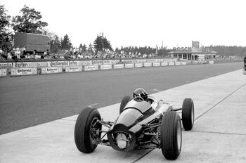 Umělecká fotografie Graham Hill in a BRM p61 monocoque in the pits, 1963