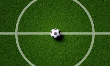 Photographie artistique Soccer field center and ball in