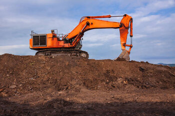 Bild auf Leinwand Backhoe are working digging on the ground