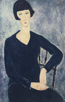 Obraz na plátně Young woman with a fringe or young seated woman in blue dress