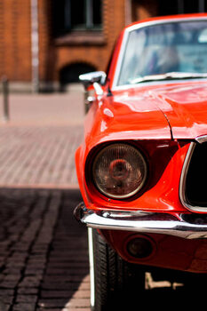 Obraz na plátně Closeup of a red classic mustang car