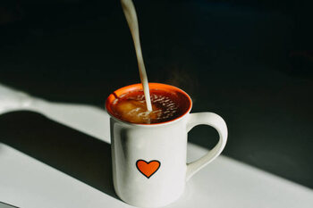 Obraz na plátně Dairy Free Milk Pouring in a Hot Tea Mug