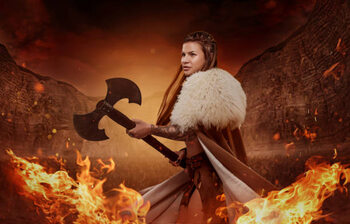 Obraz na plátně Viking inspired warrior female in a fire storm