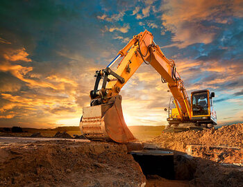 Plakat Excavator at a construction site against