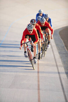 Plakát Cyclists in action on velodrome track