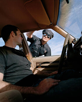 Plakát Man in car looking at police officer, close-up