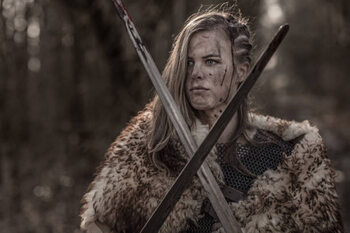 Obraz na płótnie Sword wielding viking warrior young blond