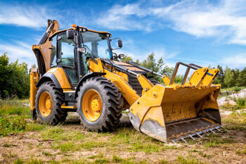 Obraz na płótnie Yellow earth mover in construction site