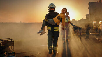 Poster Brave Firefighter Carries Injured Young Girl