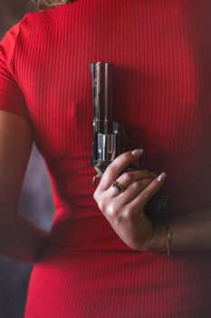 Póster young woman in red dress holding gun pistol