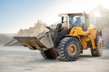 Vászonkép Digger working at quarry