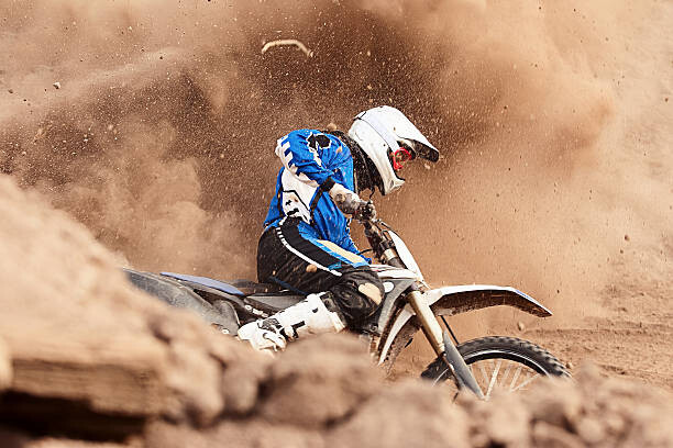 Levně Plakát, Obraz - Motocross biker taking a turn in the dirt., Daniel Milchev, 40 × 26.7 cm