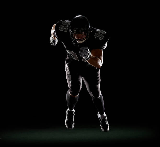 Levně Plakát, Obraz - American football player running, Lewis Mulatero, 40 × 40 cm