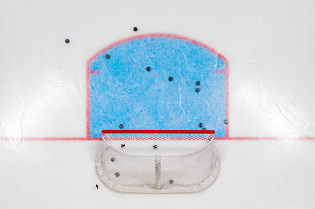 Levně Plakát, Obraz - Hockey Net with Pucks from Above, Jacob Kupferman, 40 × 26.7 cm
