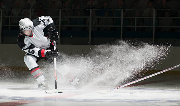 Levně Plakát, Obraz - Ice hockey players facing off, Ryan McVay, 40 × 23.7 cm