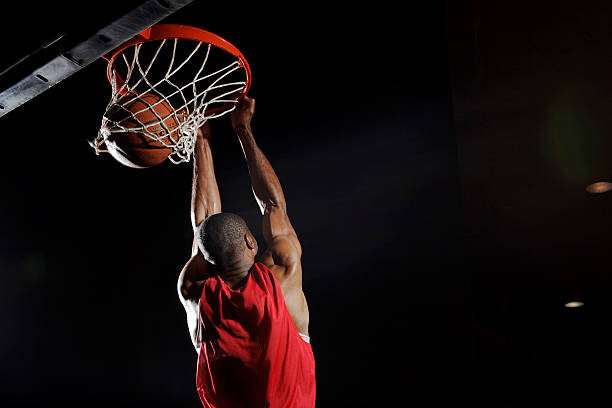 Levně Plakát, Obraz - Man dunking basketball, Matt Henry Gunther, 40 × 26.7 cm