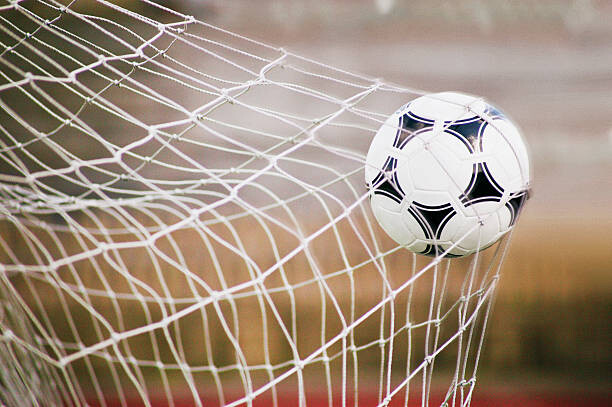 Levně Plakát, Obraz - Football Trapped in a Goal Net, Close-Up, Cocoon, 40 × 26.7 cm