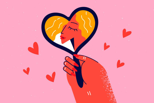 Levně Plakát, Obraz - Woman look in heart-shaped mirror, Denis Novikov, 40 × 26.7 cm