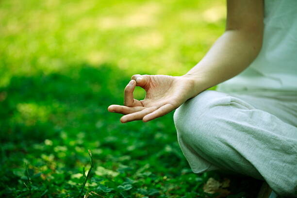 Levně Plakát, Obraz - young woman doing yoga,hand close-up, RunPhoto, 40 × 26.7 cm