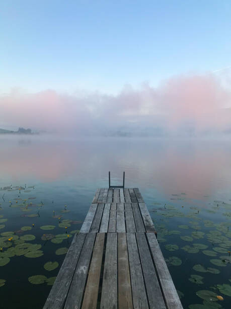 Levně Plakát, Obraz - Sunrise at lake Hopfensee with wooden, Carolin Kertscher, 30 × 40 cm