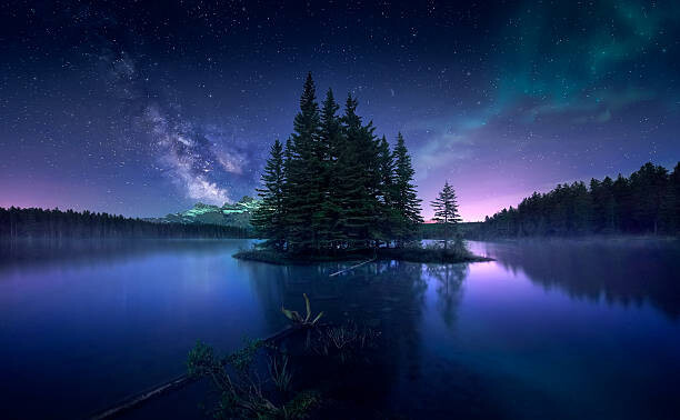 Levně Plakát, Obraz - Milky way and Aurora Borealis at Two Jack Lake, Jesús M. García, 40 × 24.7 cm