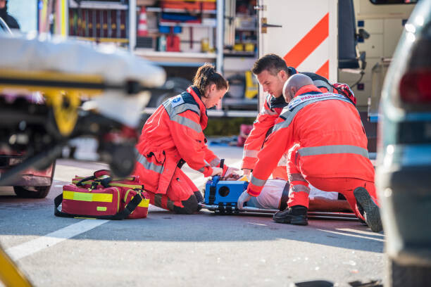 Levně Plakát, Obraz - Paramedics providing first aid, simonkr, 40 × 26.7 cm