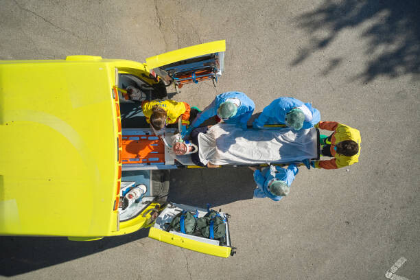 Levně Plakát, Obraz - Emergency Team Removing Man from Ambulance, xavierarnau, 40 × 26.7 cm