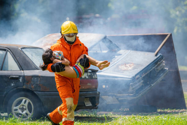 Fotografie Firefighter to save child in fire, Visoot Uthairam, 40 × 26.7 cm