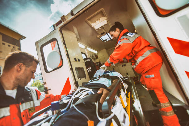 Levně Plakát, Obraz - Paramedic team pushing stretcher, simonkr, 40 × 26.7 cm