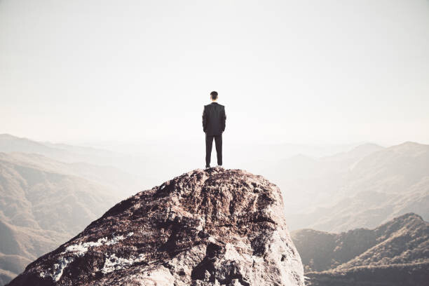 Levně Plakát, Obraz - Businessman standing on mountain, peshkov, 40 × 26.7 cm
