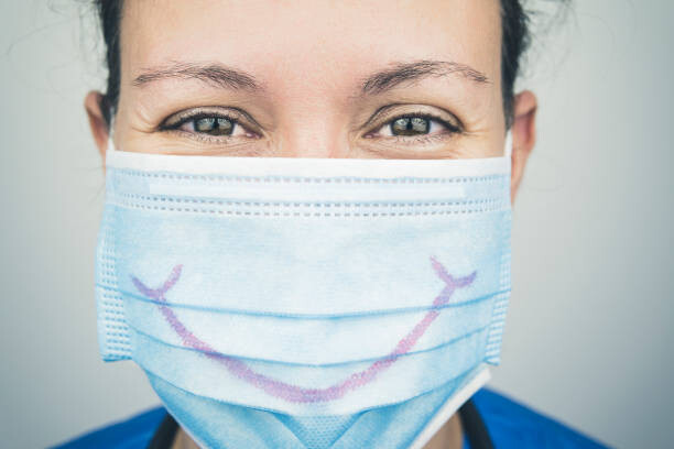 Levně Plakát, Obraz - Portrait of Nurse with mask smiling, Antonio Martin Sanchez, 40 × 26.7 cm