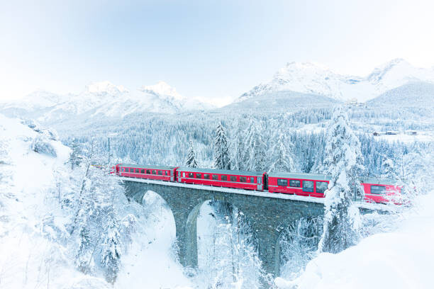 Levně Plakát, Obraz - Bernina Express train in white winter, Roberto Moiola / Sysaworld, 40 × 26.7 cm