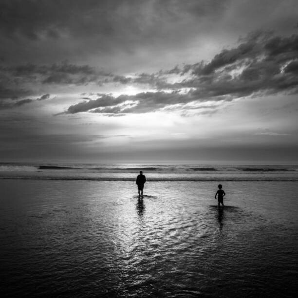 Levně Plakát, Obraz - A father and son wade into, Cavan Images, 40 × 40 cm
