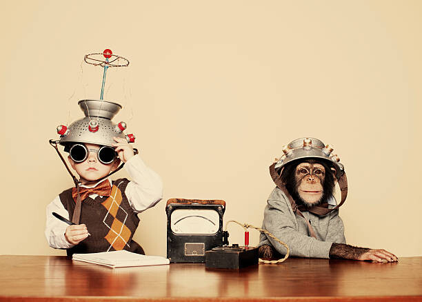 Fotografie Young Boy Nerd Reads Chimpanzee Mind, RichVintage, 40 × 30 cm