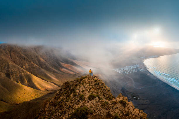 Fotografie Couple standing on top of a, © Marco Bottigelli, 40 × 26.7 cm