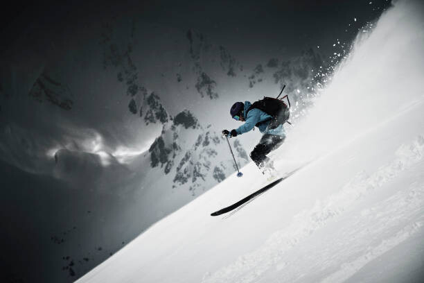 Levně Plakát, Obraz - Male skier speeding down steep mountainside,, Ross Woodhall, 40 × 26.7 cm