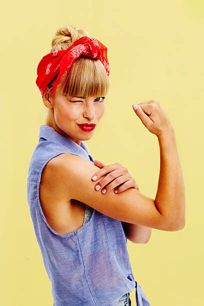 Levně Plakát, Obraz - Beautiful woman flexing muscle, SanneBerg, 26.7 × 40 cm