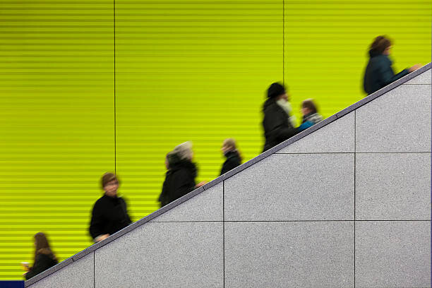 Plakát, Obraz - Civilians riding an escalator with a, sebastian-julian, 40 × 26.7 cm