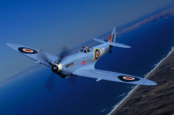 Levně Plakát, Obraz - Blue British Spitfire fighter plane, Philip Wallick, 40 × 26.7 cm