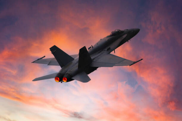 Plakát, Obraz - Military fighter aircraft in the sky at sunset, fhm, 40 × 26.7 cm