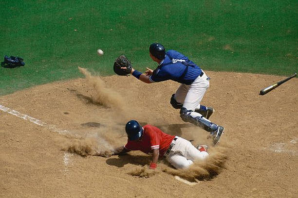 Levně Plakát, Obraz - Baseball catcher fielding ball as base, David Madison, 40 × 26.7 cm
