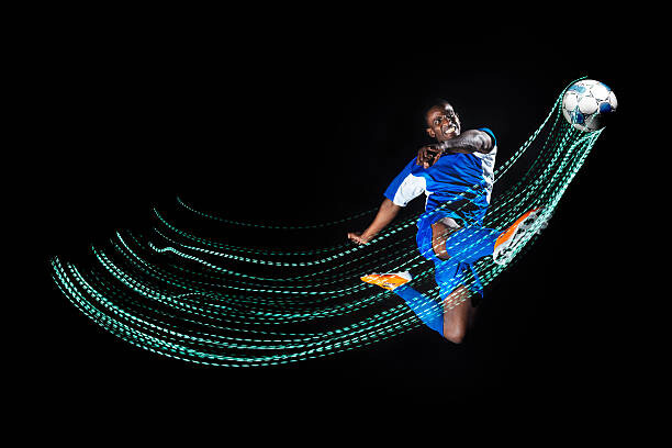 Plakát, Obraz - Football/ soccer player with lighttrace, Henrik Sorensen, 40 × 26.7 cm