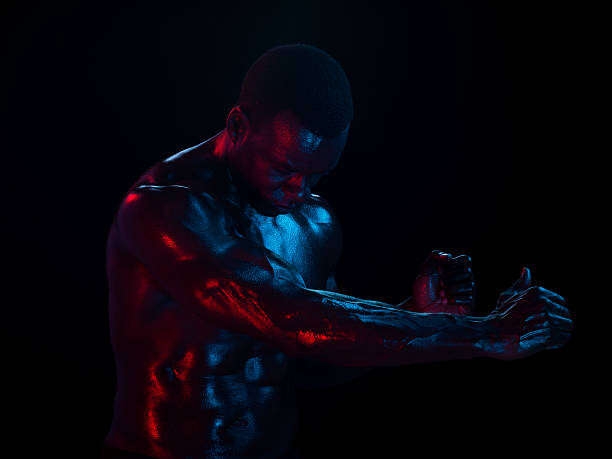 Fotografie Athletic male arm stretched forward, head down, Jonathan Knowles, 40 × 30 cm