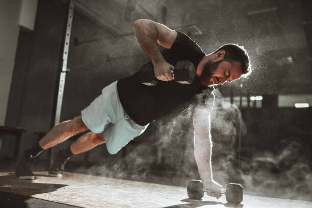 Levně Plakát, Obraz - Male During Dumbbell Plank And Pushups, AleksandarGeorgiev, 40 × 26.7 cm