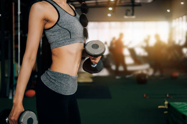 Plakát, Obraz - sport woman at fitness gym club, veerasakpiyawatanakul, 40 × 26.7 cm