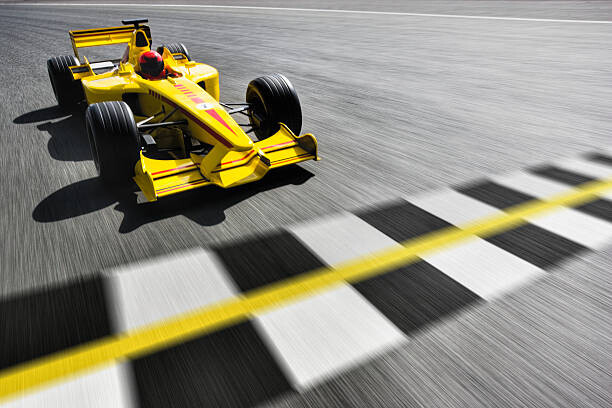 Levně Plakát, Obraz - Formula One Racecar Crossing Finish Line, David Madison, 40 × 26.7 cm