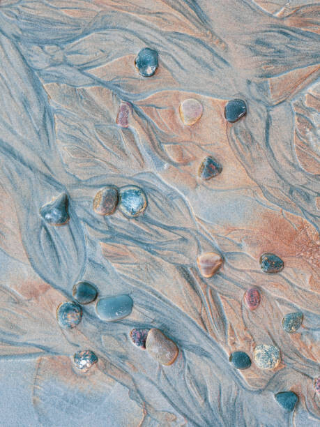 Umělecká fotografie Close-up of pebbles and textured sand, Johner Images, (30 x 40 cm)