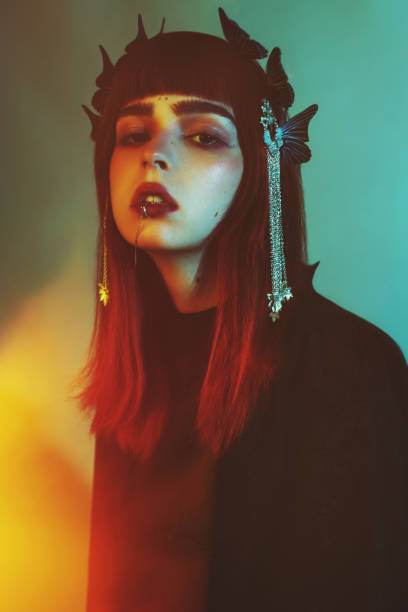 Fotografie Redhead gothic model in black dress in studio., iiievgeniy, (26.7 x 40 cm)