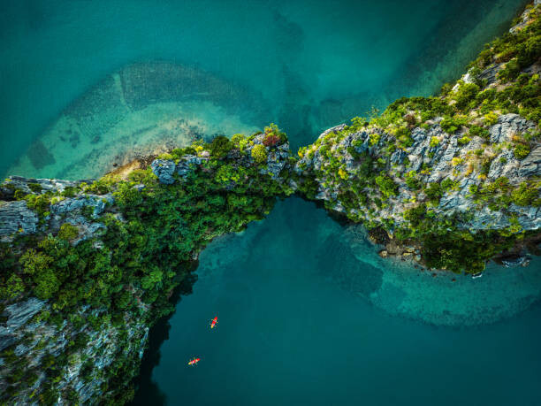 Fotografie Drone view on rocks and canoes, Nikada, 40x30 cm