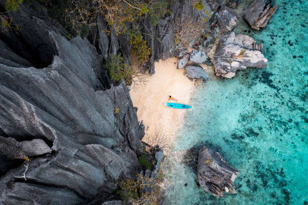 Fotografie Aerial view of woman with kayak, Marco Bottigelli, 40 × 26.7 cm